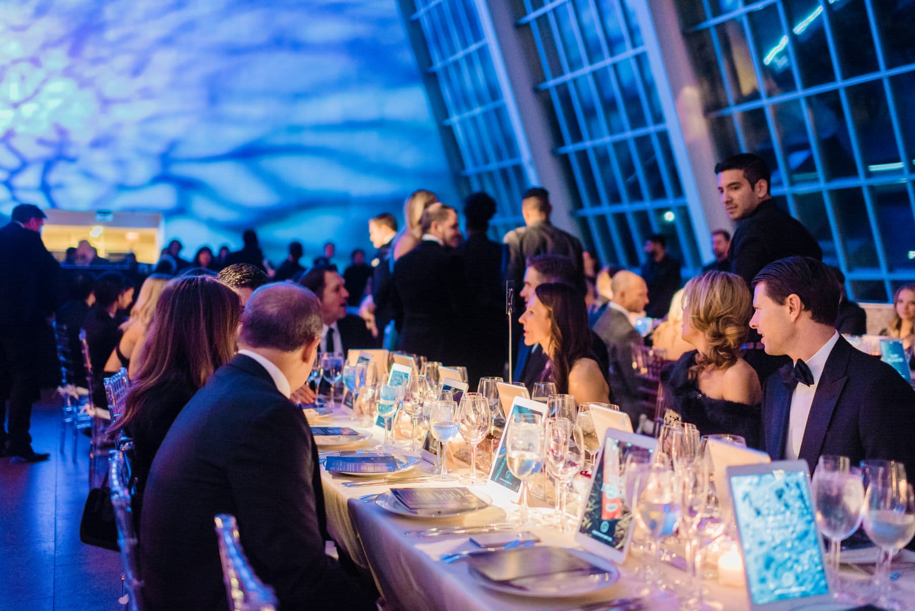 Guests using iPads to donate at the charity:water Gala, Metropolitan Museum of Art